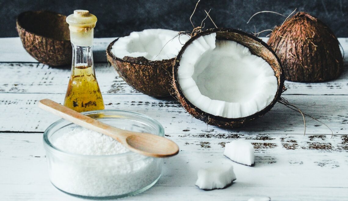 white powder in clear glass jar beside brown wooden spoon