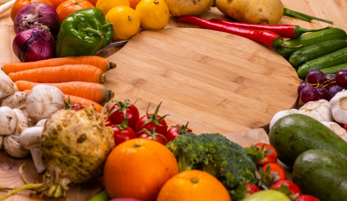 orange and green vegetables on brown wooden table